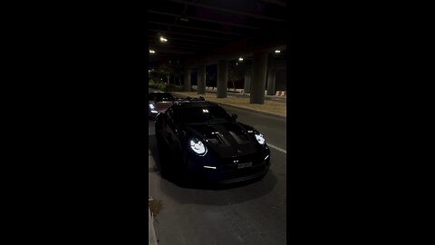 Sleek Black Porsche in Action: Power & Luxury Unleashed 🏎️🖤