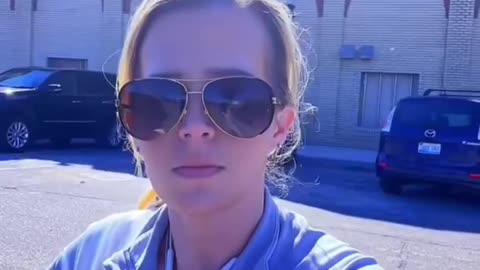 Woman records the Muslim call to prayer being broadcast over loudspeakers...
