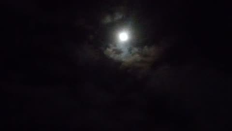 I'm Outside just looking at the Moon at Nighttime
