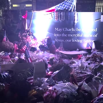 Massive Sea of Flowers Spotted Outside of TPUSA Headquarters at Night