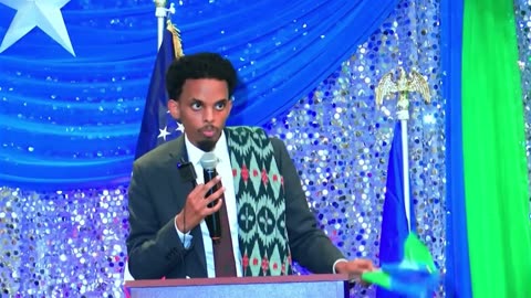 Omar Fateh waves foreign flag, speaks a foreign language