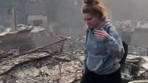 LA woman films the aftermath of a wildfire at what used to be her home.