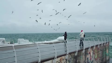 Odesa residents seek joy at icy sea amid cold temperatures, power cuts