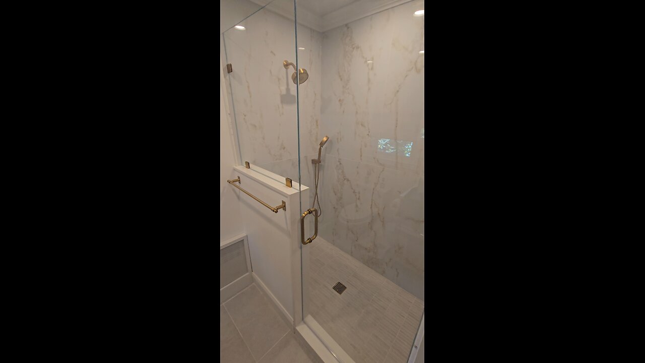 Custom Frameless Shower with Modern Brass Hardware