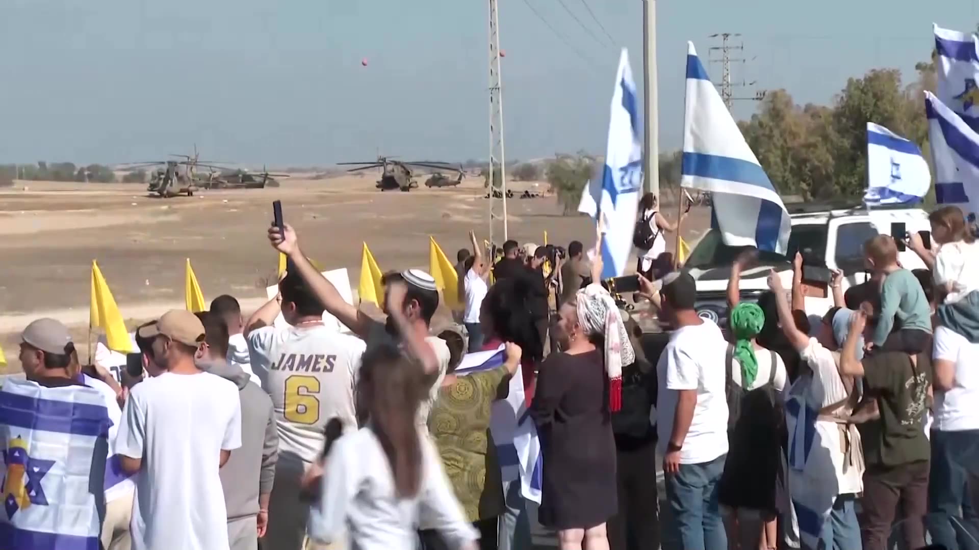 Convoy believed to carry released Israeli hostages greeted with cheers