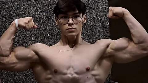 Young man flexing muscles