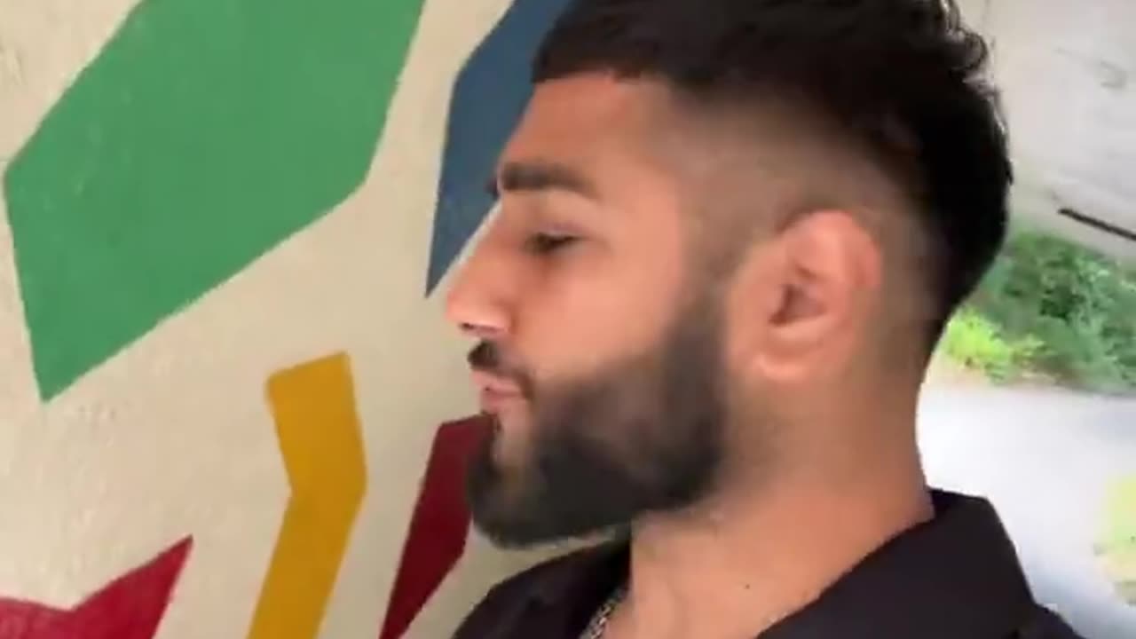 A Muslim in UK spits on St George's Cross. They hate us.