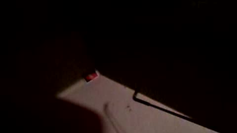 Giggly over UNO card falling under the table, using fishing line to, err, fish it out