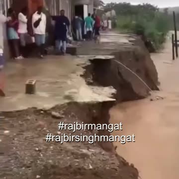 Roads in Bath, St. Thomas, Jamaica, are now impassable as rising river waters have taken over the