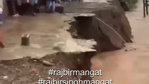Roads in Bath, St. Thomas, Jamaica, are now impassable as rising river waters have taken over the