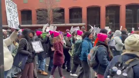 People’s March attendees in DC chant “hey hey, ho ho, Donald Trump has got to go”...