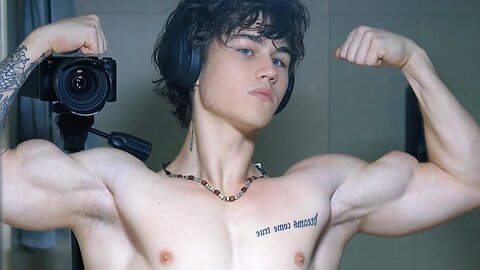 Handsome muscular man showing off his muscles