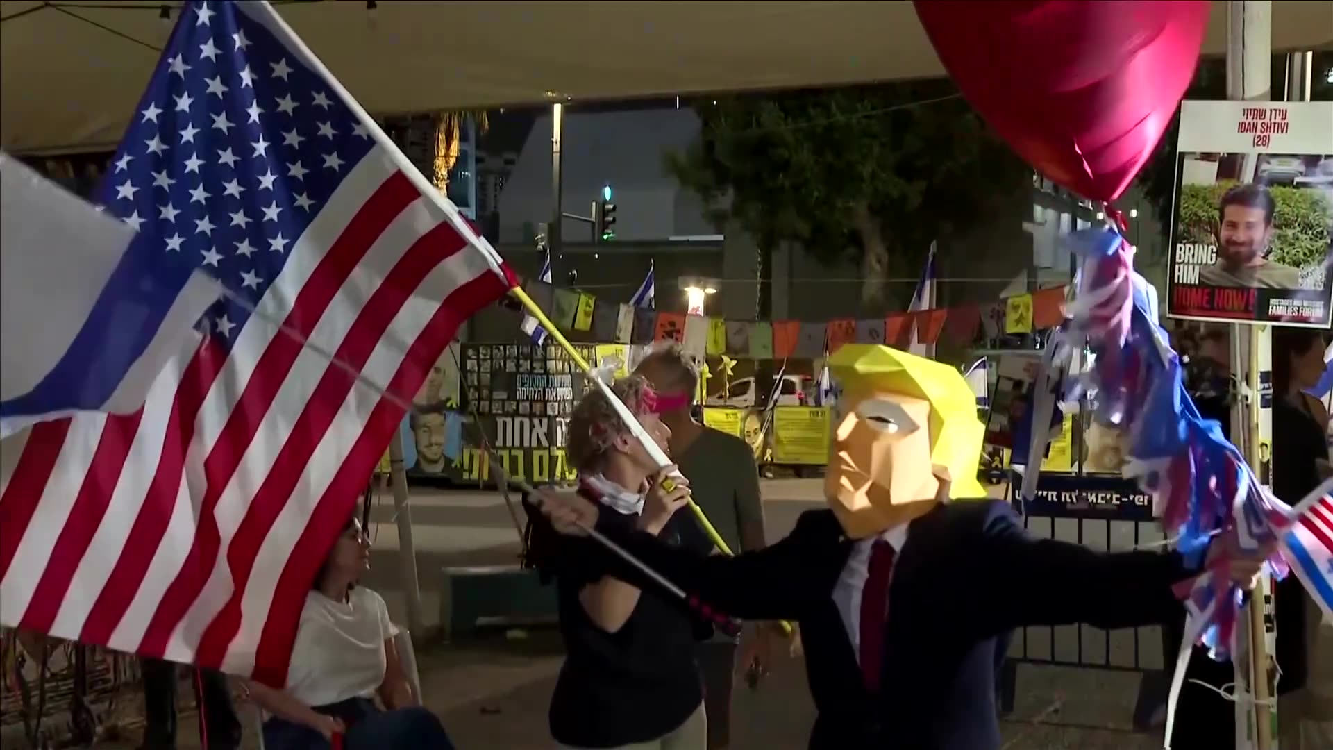Israelis celebrate Gaza deal with US flags and a Trump costume