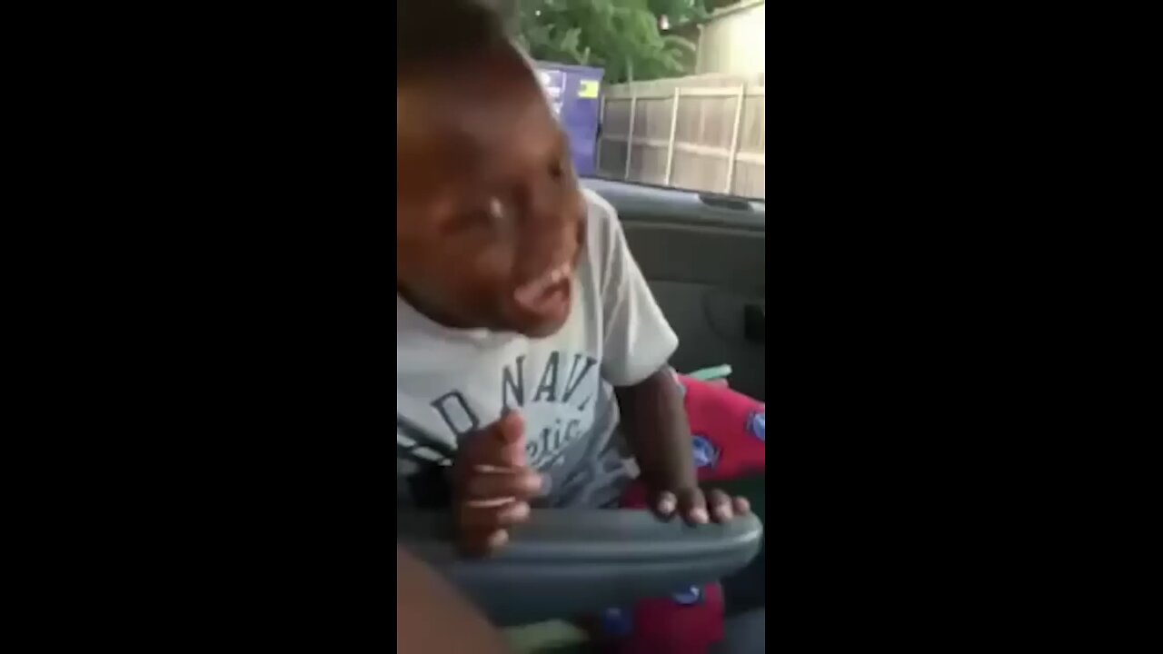 Black funny kids laughing in car