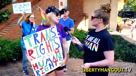 Lady with 'Trans Rights Are Human Rights' sign tells me "Trump is going to