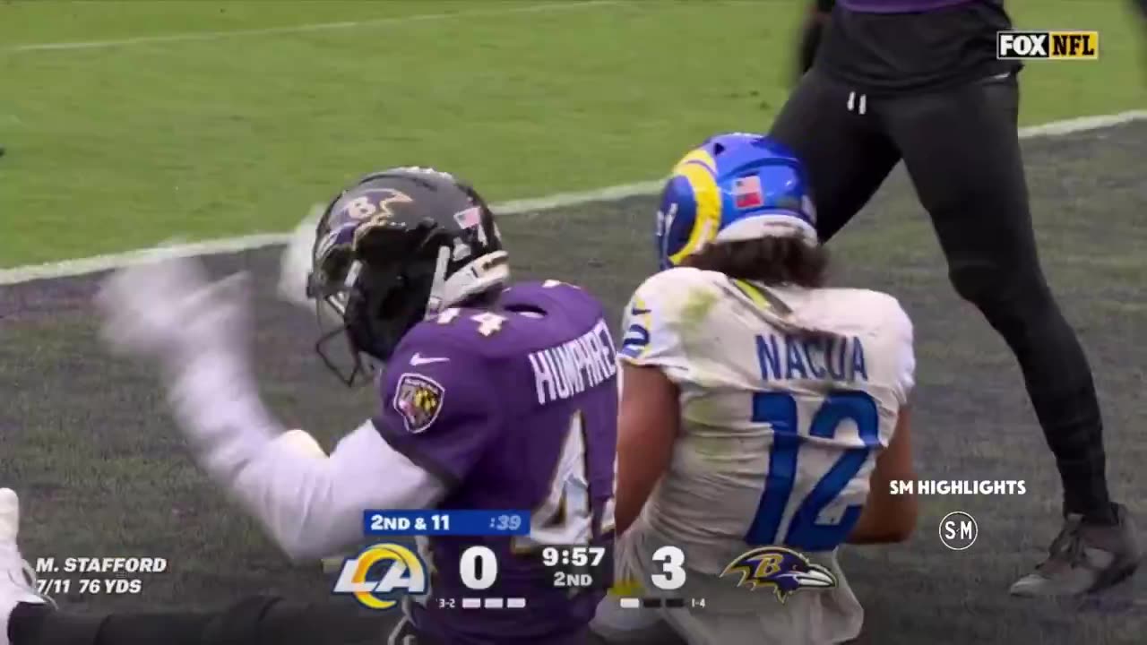 WR Puka Nacua down in the end zone in a lot of pain, holding his left shin