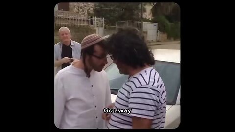 Israeli settler tries to steal a Palestinian home.
