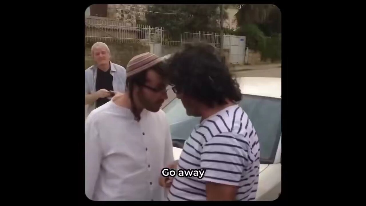 Israeli settler tries to steal a Palestinian home.