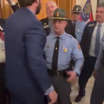 Colton Moore gets pushed to the floor