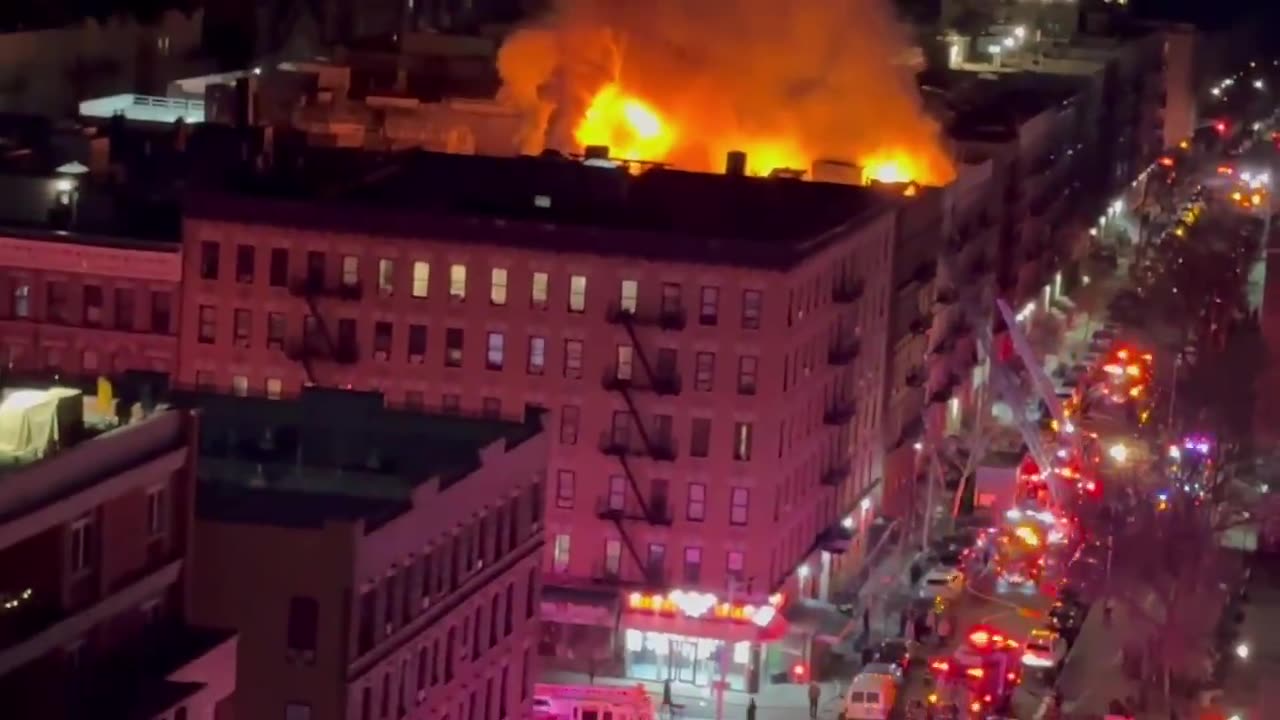 The NYFD is battling a massive 4-alarm blaze at an apartment building in Manhattan.