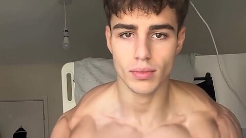 Handsome muscular man showing off his muscles