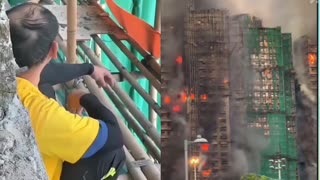 Shocking footage shows workers casually smoking while repairing the exterior wall of