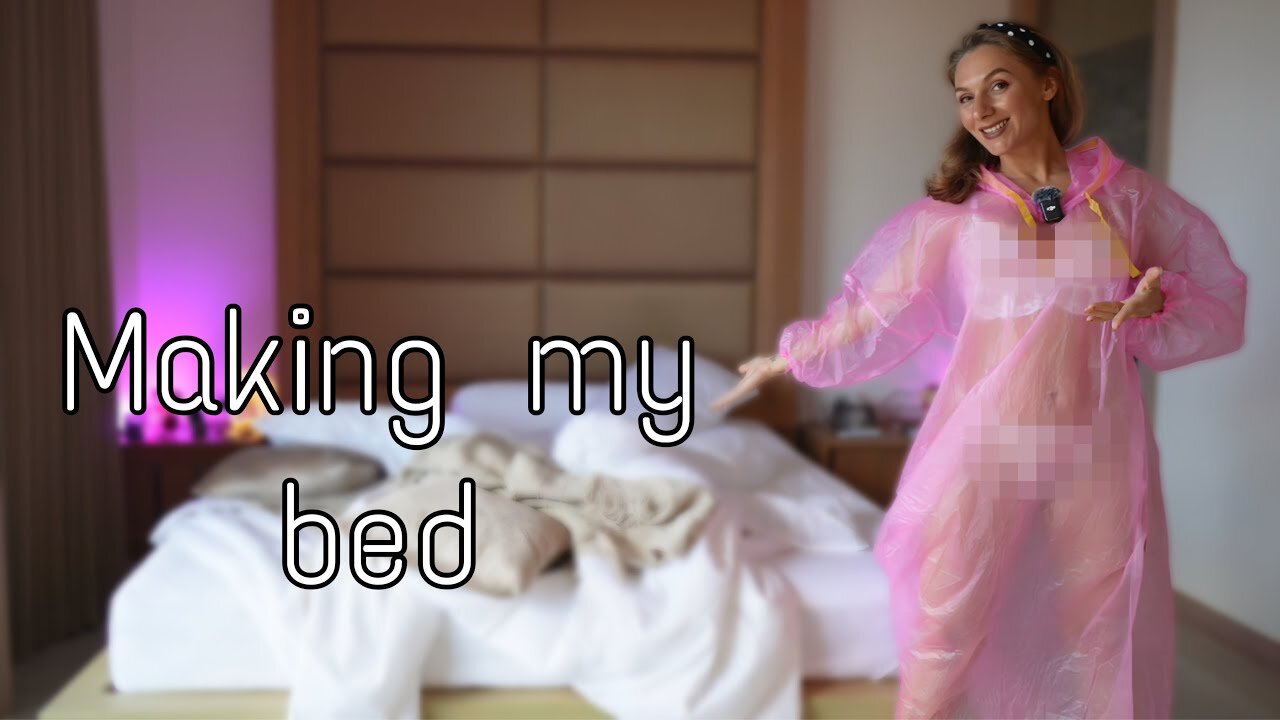 4K Making my bed in a pink raincoat