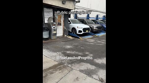 A public parking lot with stacked car lifts New York got a hustle for everything 😂