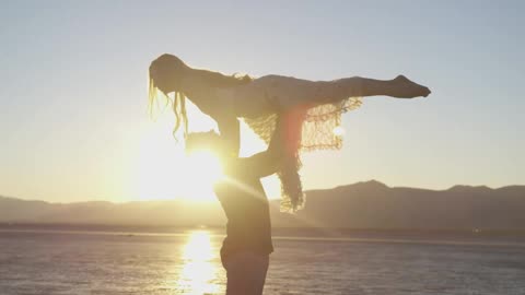 Couple in Beach Sunset, She Jump At his Arms so deeply, Lovely!