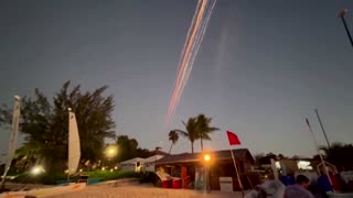 Falling debris from SpaceX's Starship streaks through the sky