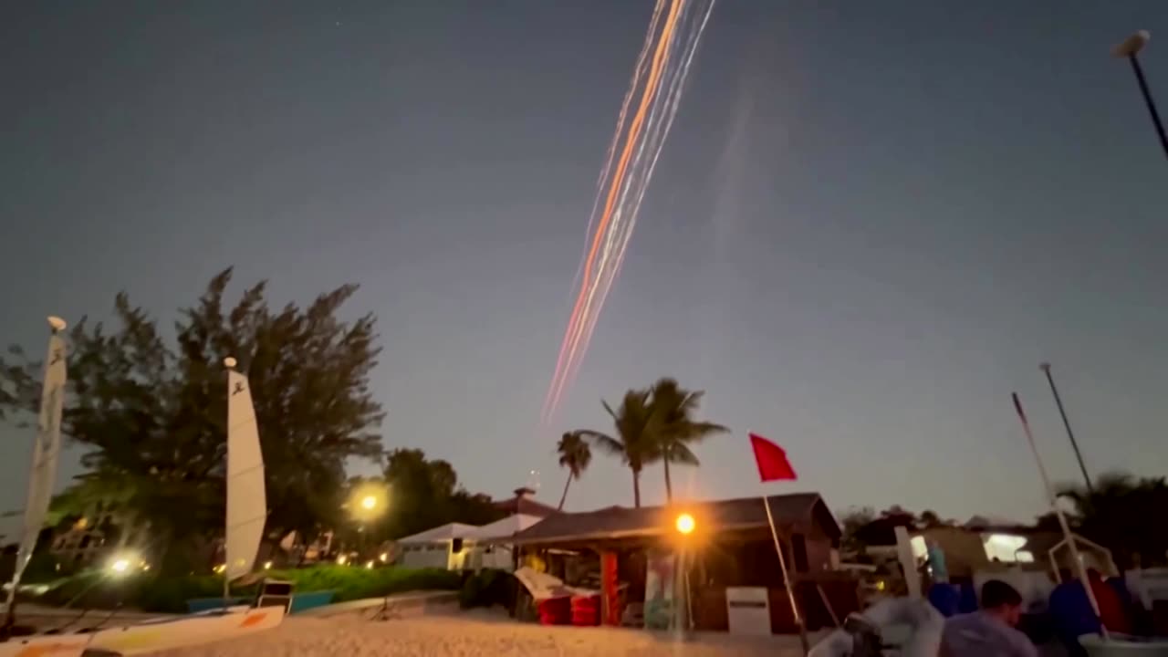 Falling debris from SpaceX's Starship streaks through the sky