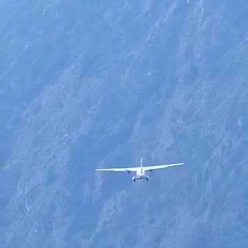 Takeoff of the Let L-410 Turbolet at the airport of Lukla in Nepal