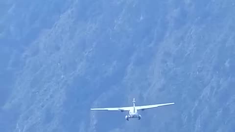 Takeoff of the Let L-410 Turbolet at the airport of Lukla in Nepal
