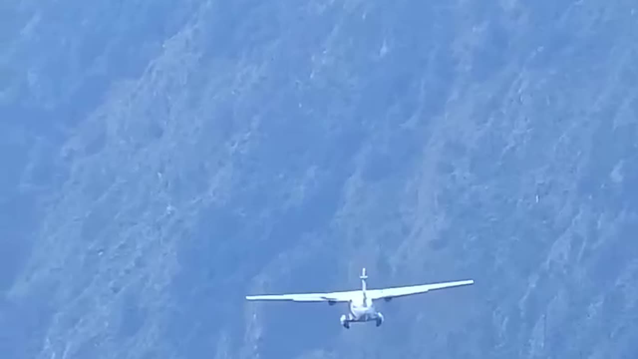 Takeoff of the Let L-410 Turbolet at the airport of Lukla in Nepal