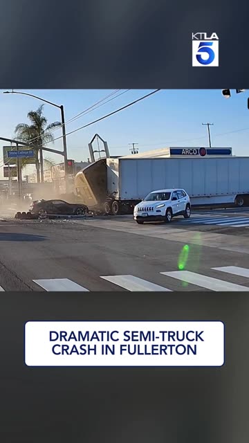 A semi truck plows into stopped traffic at a red light in Fullerton, California