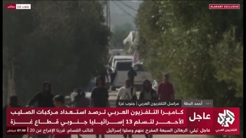 Red Cross vehicles at the handover point of the second wave of kidnapped people,
