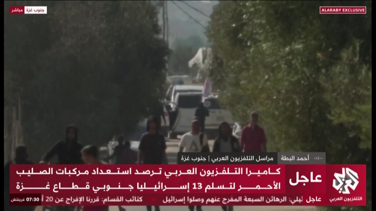 Red Cross vehicles at the handover point of the second wave of kidnapped people,