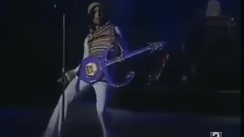 Prince doing Prince on guitar, guitar solo, rock, live, concert