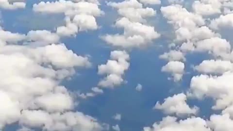 Wild footage shows a skydiver’s parachute snagged on a plane’s tail at 15,000ft during