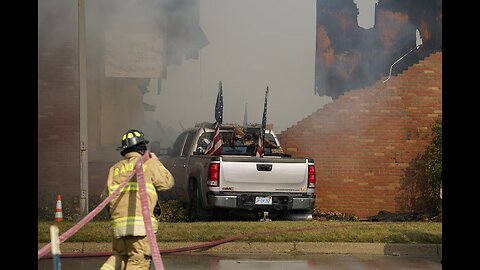New footage shows a dead body on the ground next to the burning Mormon Church in Grand Blanc, 