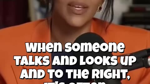 talks and looks up and to the right - imagining something, or potentially lying