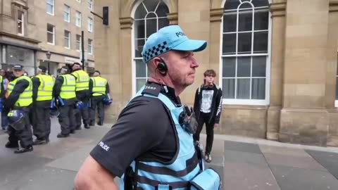 16 yr old girl has flag snatched by police in Newcastle