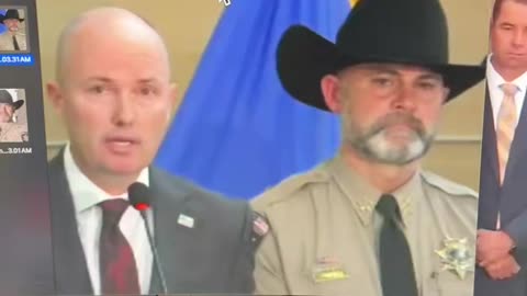 The Sheriff standing behind Governor Cox and the FBI director is an Actor