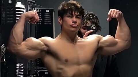 Handsome muscular man showing off his muscles