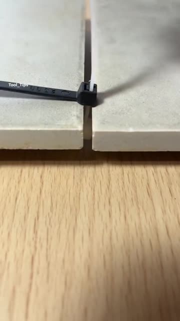 Close-Up of Gray Ceramic Tile Samples on Wooden Surface