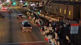 A mob flying foreign flags protest in Georgia against mass deportations