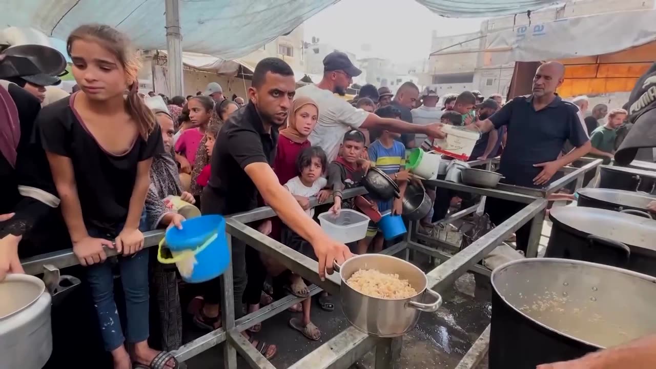 Palestinians crowd Gaza soup kitchen in search of food