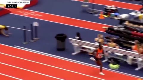 Female Runner Beats Fellow Runner with Baton