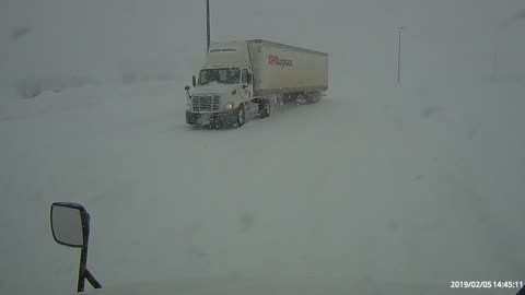 Truck driver picking up and delivering freight in a snow storm