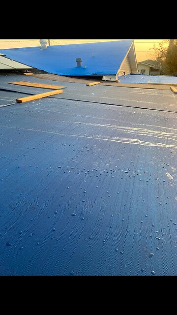 210901 Tarping the roof after Ida.